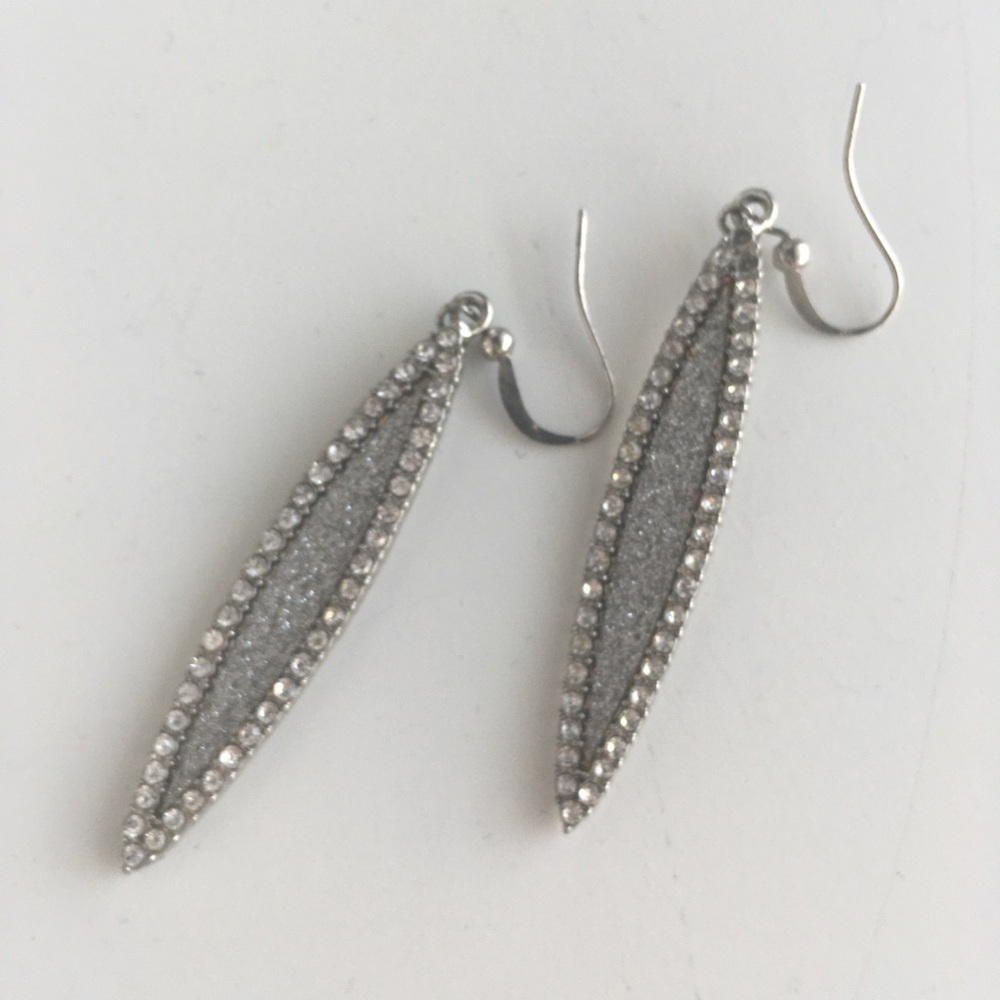 Faux silver earrings.